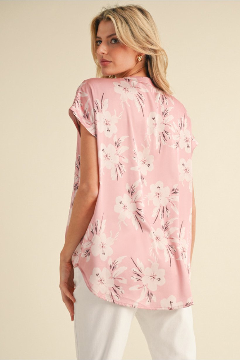 Chic mauve floral satin top with short cap sleeves, ideal for coastal boutique clothing and women's fashion.