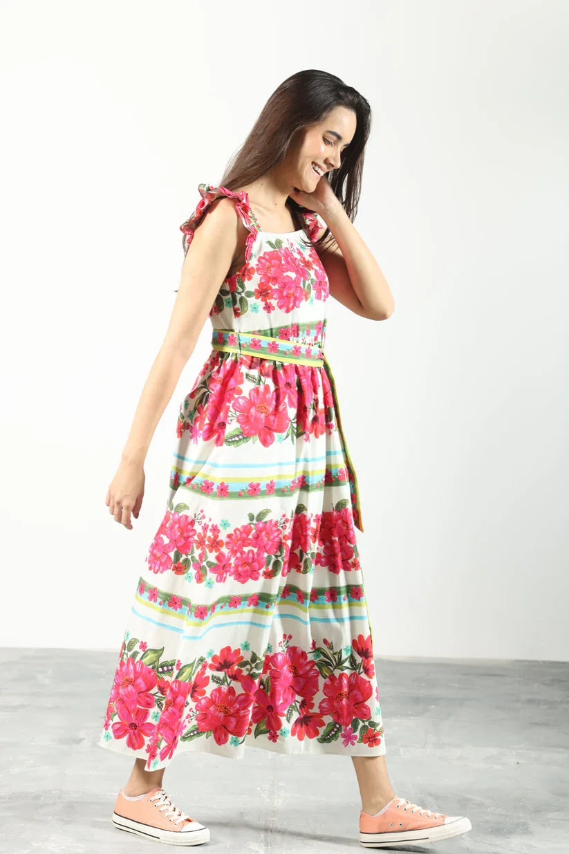 Colorful floral belted midi sundress from a Port Aransas boutique, perfect for beach days and summer outings.