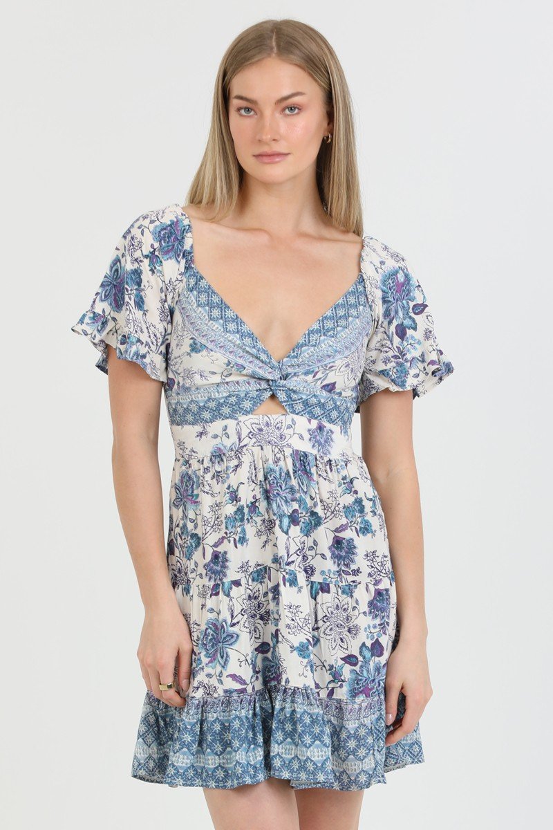 Blue and ivory twist front dress from a coastal boutique, perfect for summer events and tropical vacations.