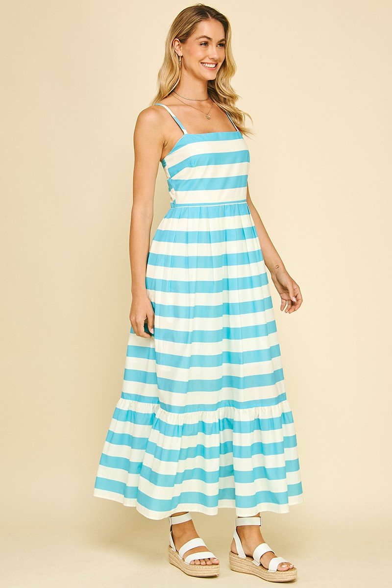Light blue striped maxi dress ideal for summer, perfect for coastal boutiques and tropical vacations. Comfort meets elegance.