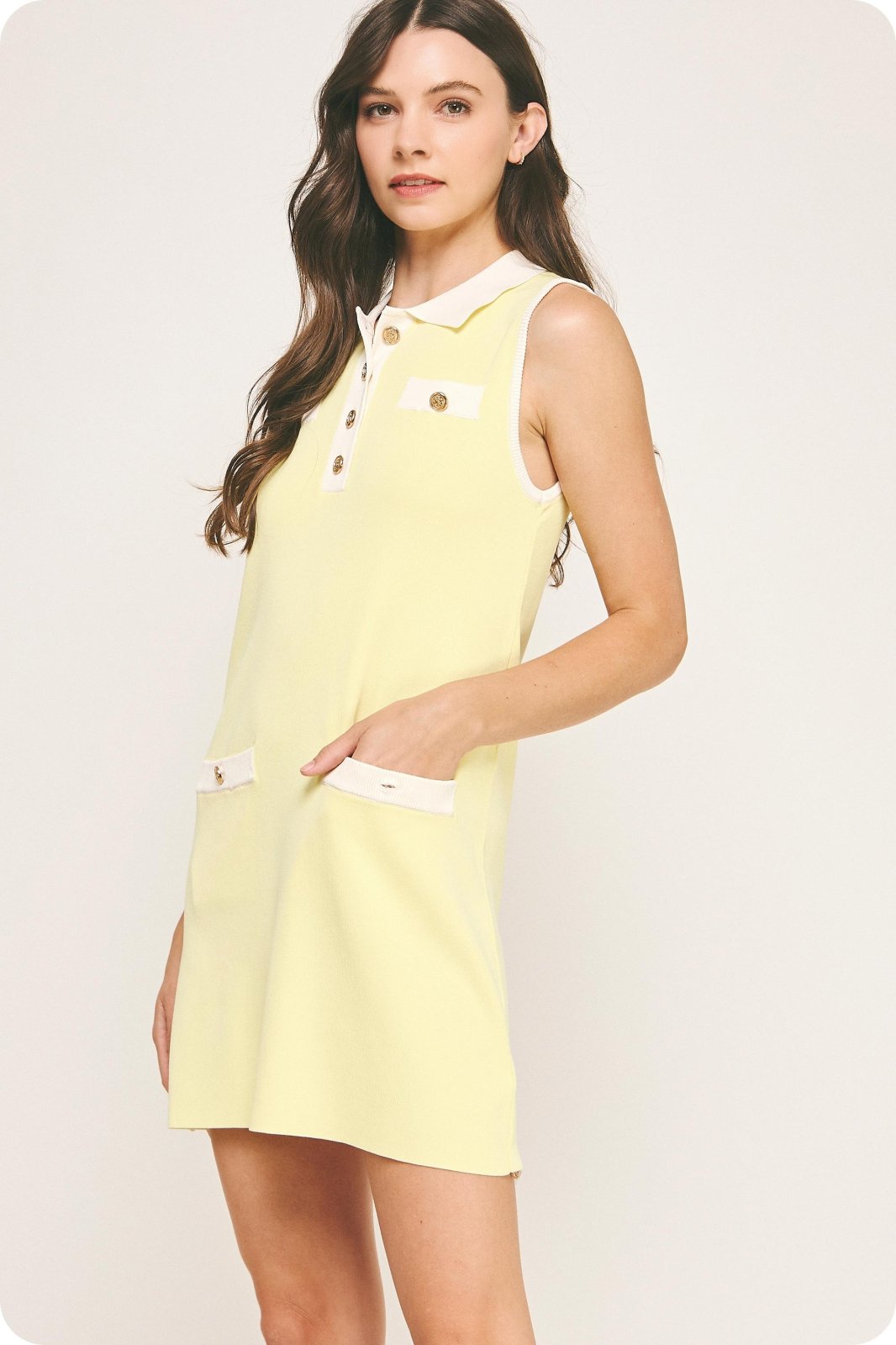 Lemon yellow sleeveless polo mini dress with pockets, perfect for beach outings and coastal boutique clothing.