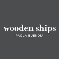 Wooden Ships brand logo by Paola Buendia, showcasing stylish women's coastal fashion.