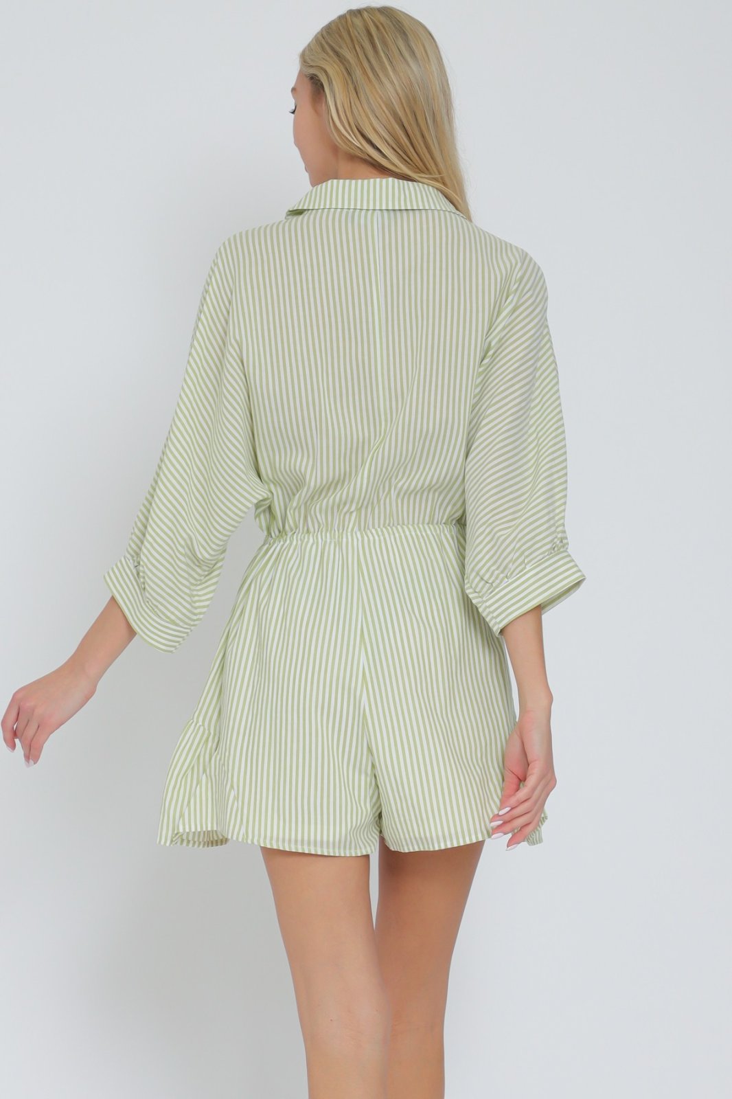 Lime green and white striped romper with tie-front waist, perfect for coastal boutique clothing and tropical vacation dresses.
