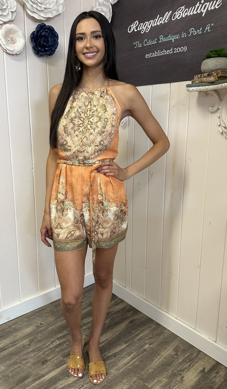 Light apricot multi halter romper styled for summer, perfect for coastal boutique clothing and beach dresses at Ragdoll Boutique.