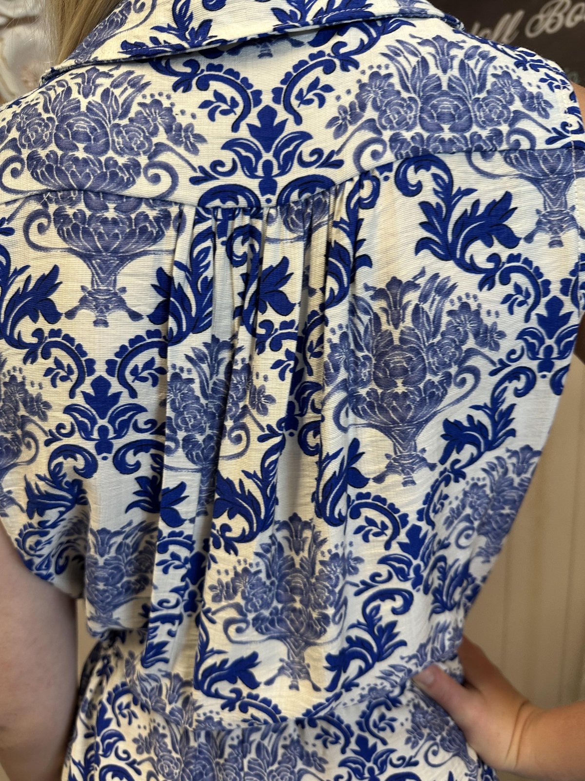 Back detail of the Nicole Romper showcasing its blue floral print, perfect for coastal boutique clothing in Port Aransas.