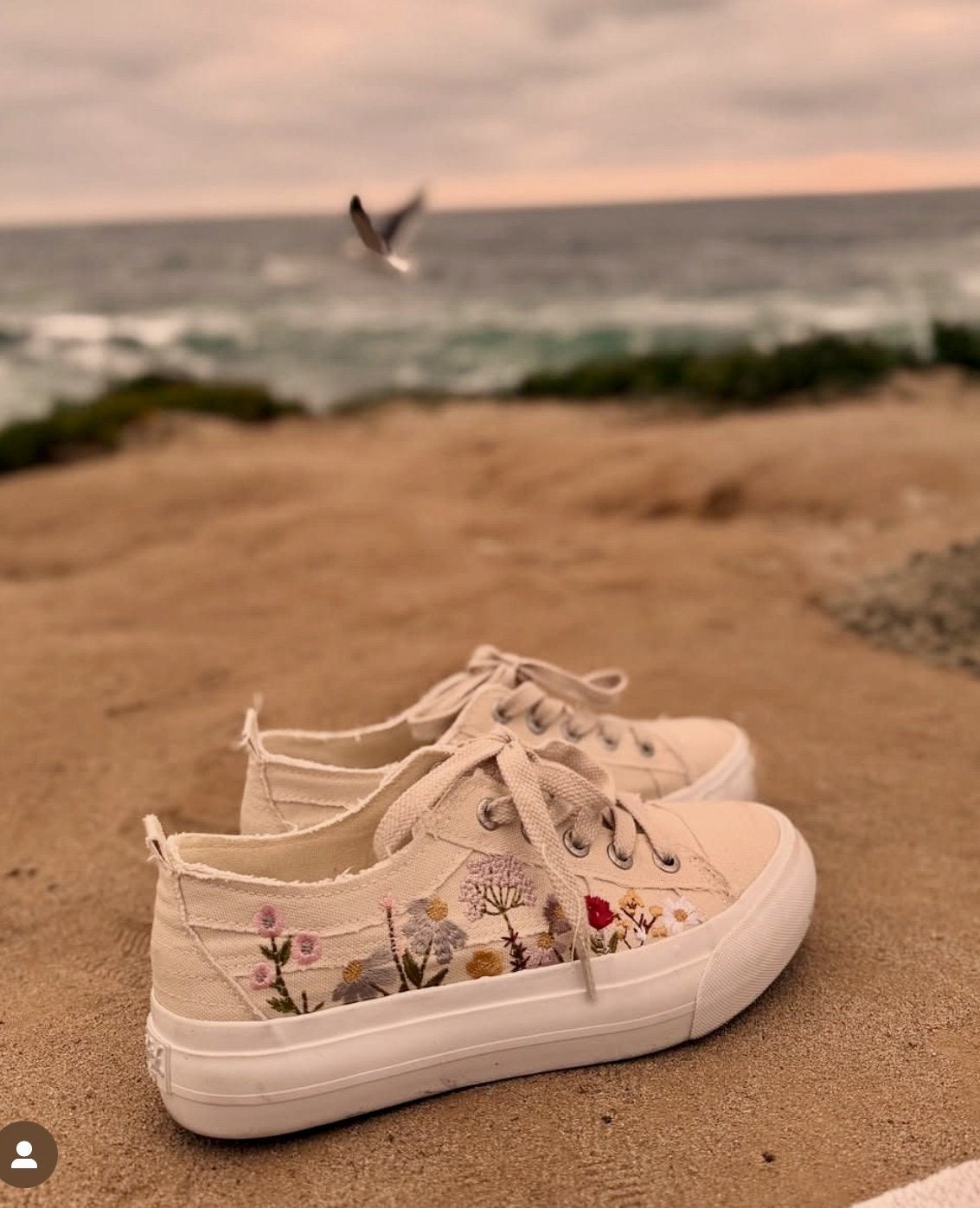 Sadie Sun Sneaker displayed on sandy beach, perfect for trendy coastal style from Raggdoll Boutique.