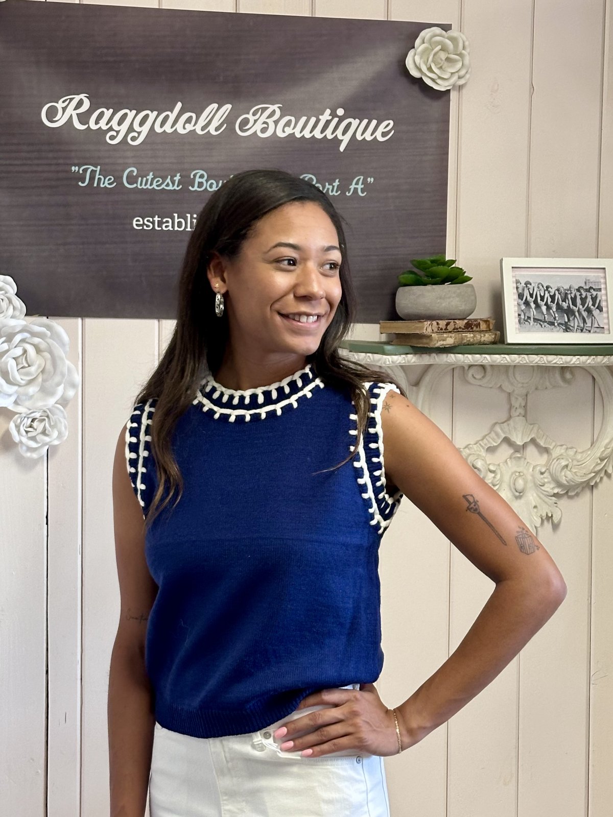 Navy sleeveless knit tank top with white embroidery at Raggdoll Boutique, stylish coastal clothing for women.