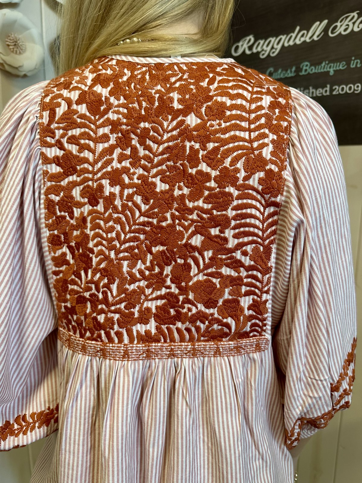 Jessa Top featuring intricate floral embroidery on the back, from Raggdoll Boutique, perfect for coastal fashion.