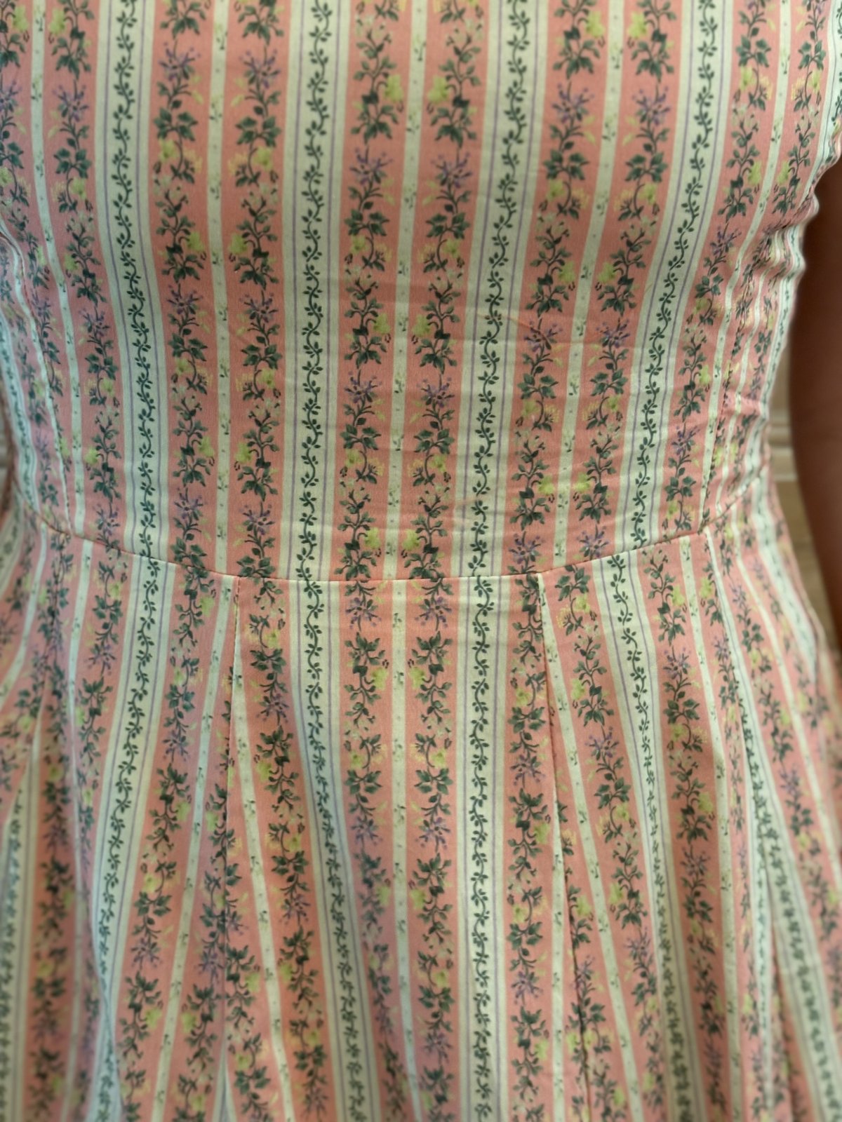 Light coral floral pattern fit and flare dress perfect for spring and summer—coastal boutique clothing ideal for beach outings.