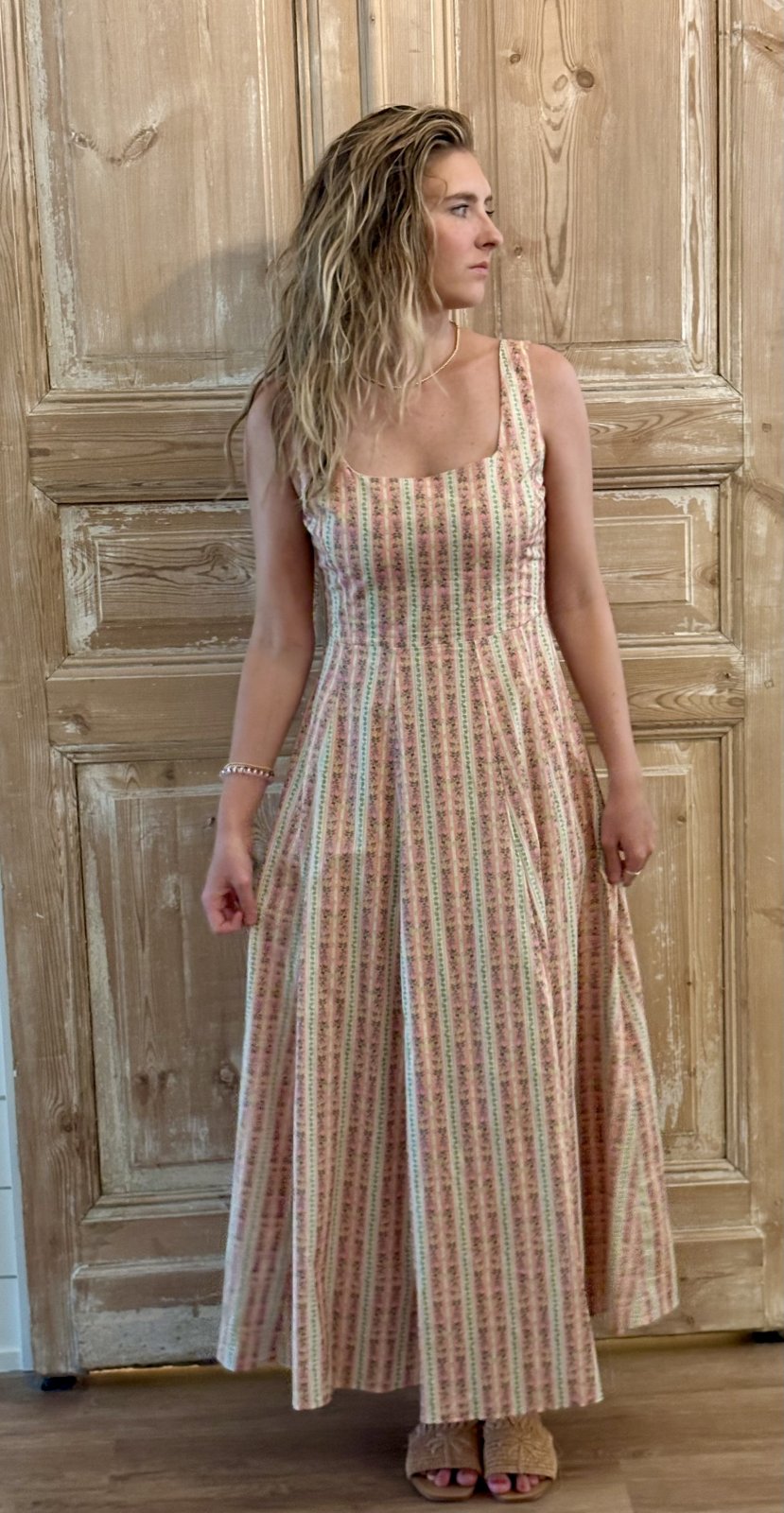 Light coral floral fit and flare midi dress from a Port Aransas boutique, perfect for summer outings and coastal fashion.