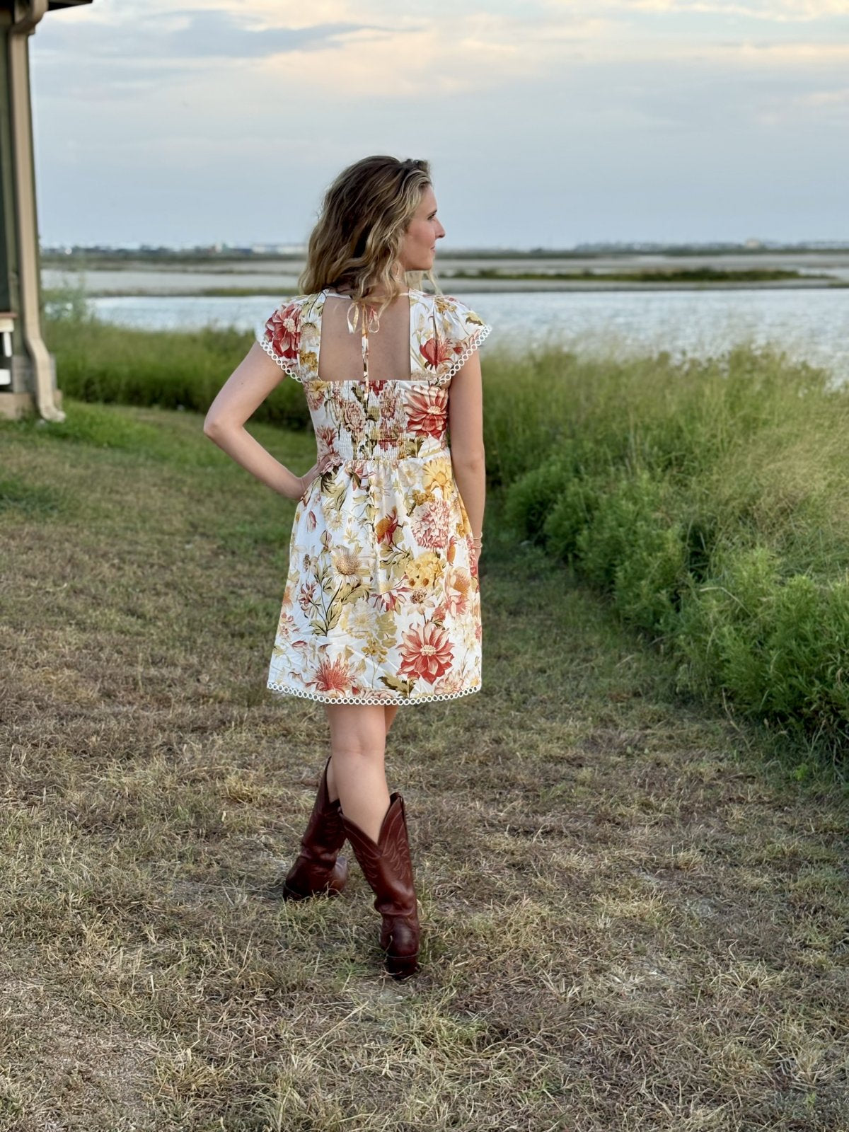 Autumn floral mini dress from a Port Aransas boutique, perfect for boho-chic style and coastal boutique clothing.