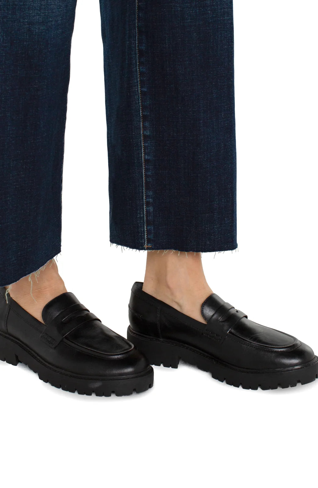 Casual black loafers styled with hi-rise jeans from Liverpool brand, perfect for coastal boutique clothing and curated women's fashion.