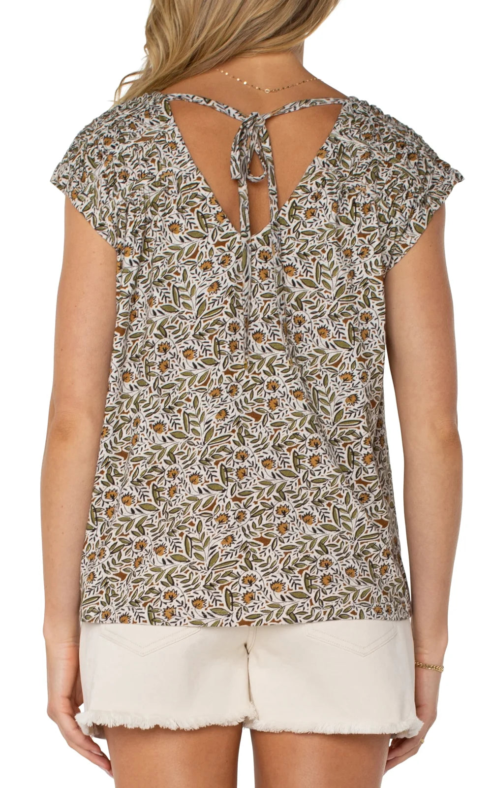 Olive print tie-back top with shirred sleeves, perfect for beach dresses and casual styling from a Port Aransas boutique.