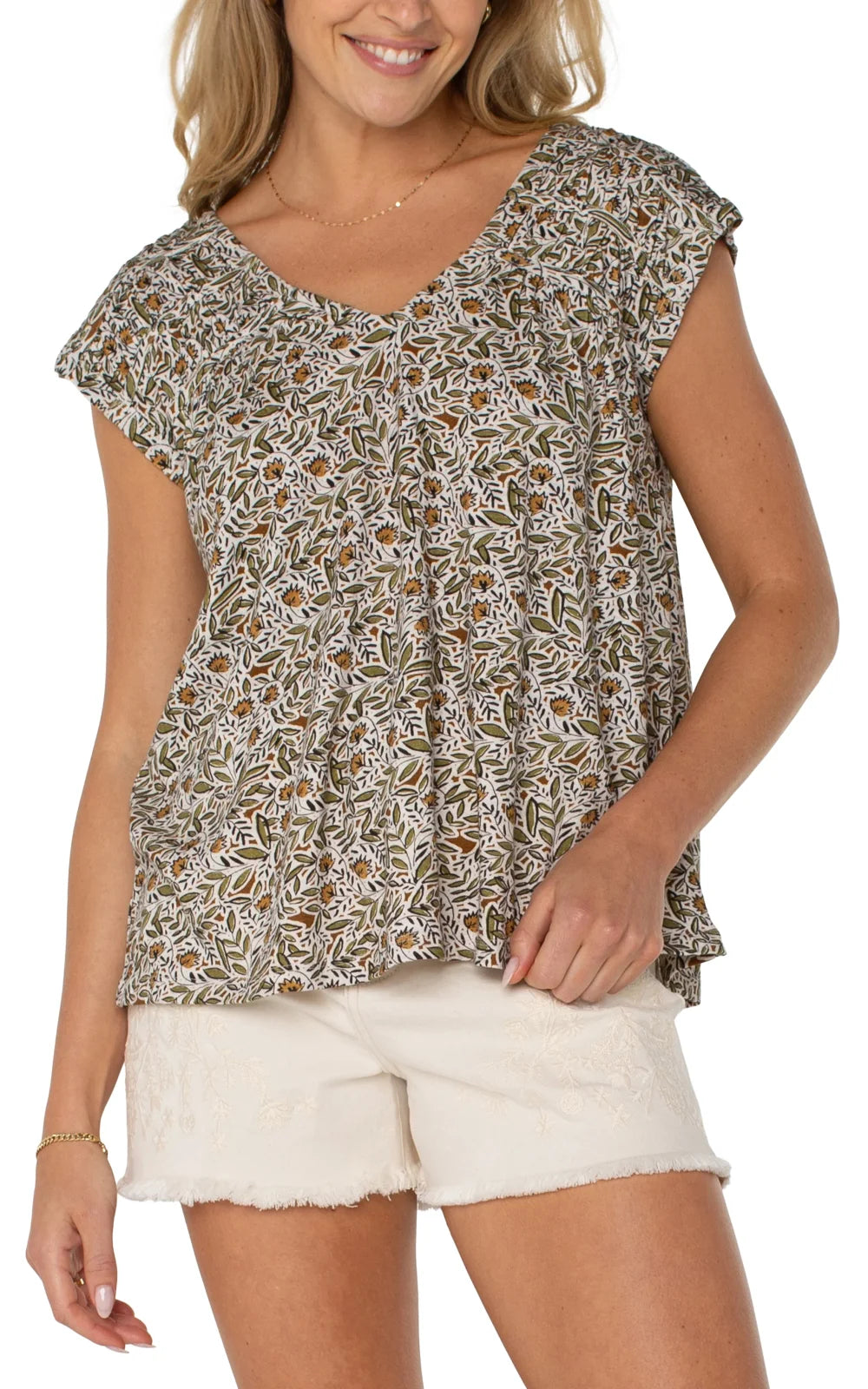 Olive print tie-back top from a Port Aransas boutique, styled with shorts for a coastal chic look.