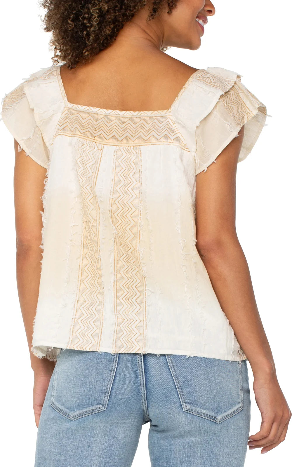 Back view of a stylish short sleeve top with flutter sleeves and chevron detailing, perfect for coastal boutique clothing.