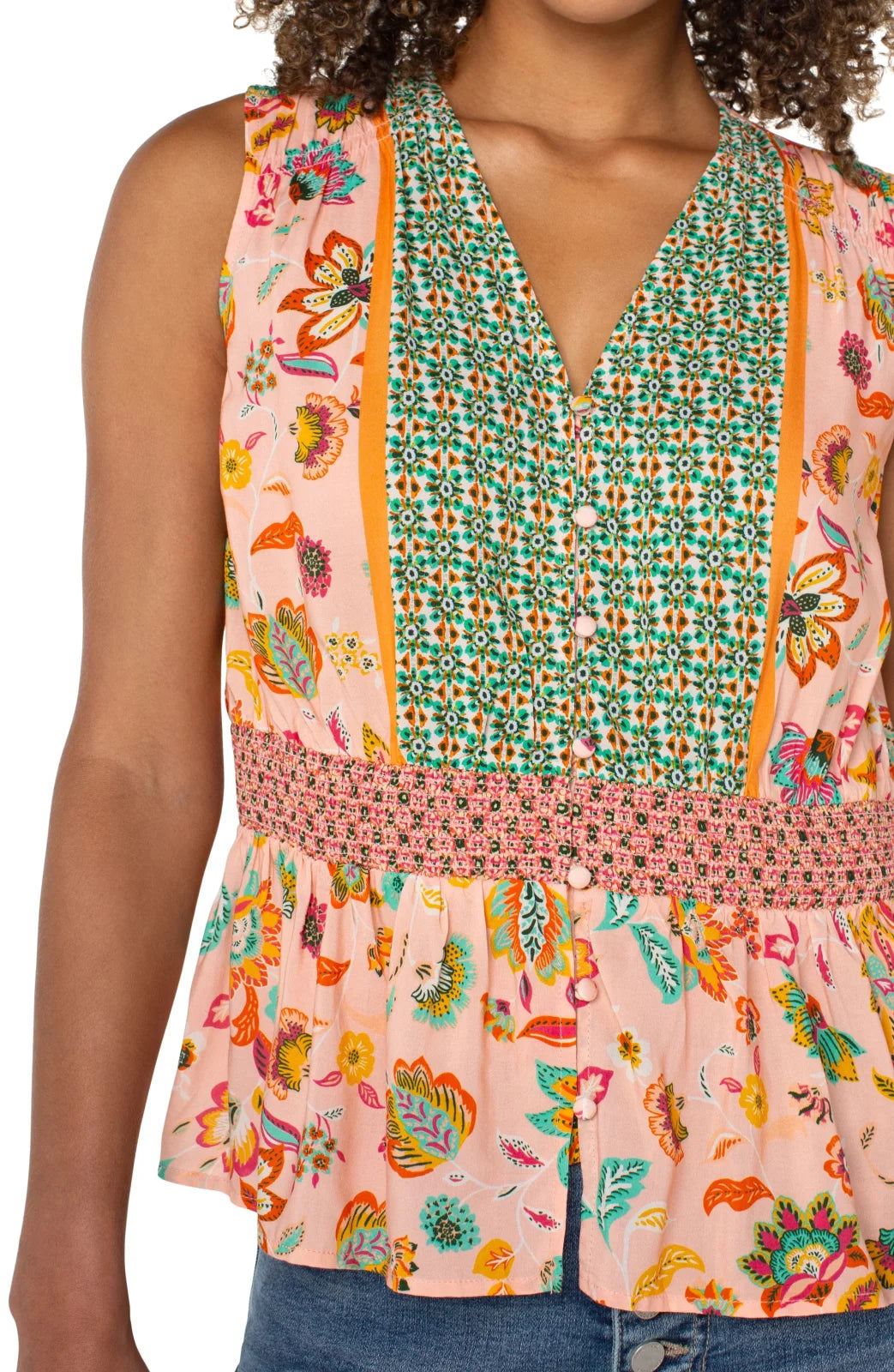 Stylish LP sleeveless top with floral print and smocked waist, perfect for coastal boutique clothing and tropical vacation outfits.