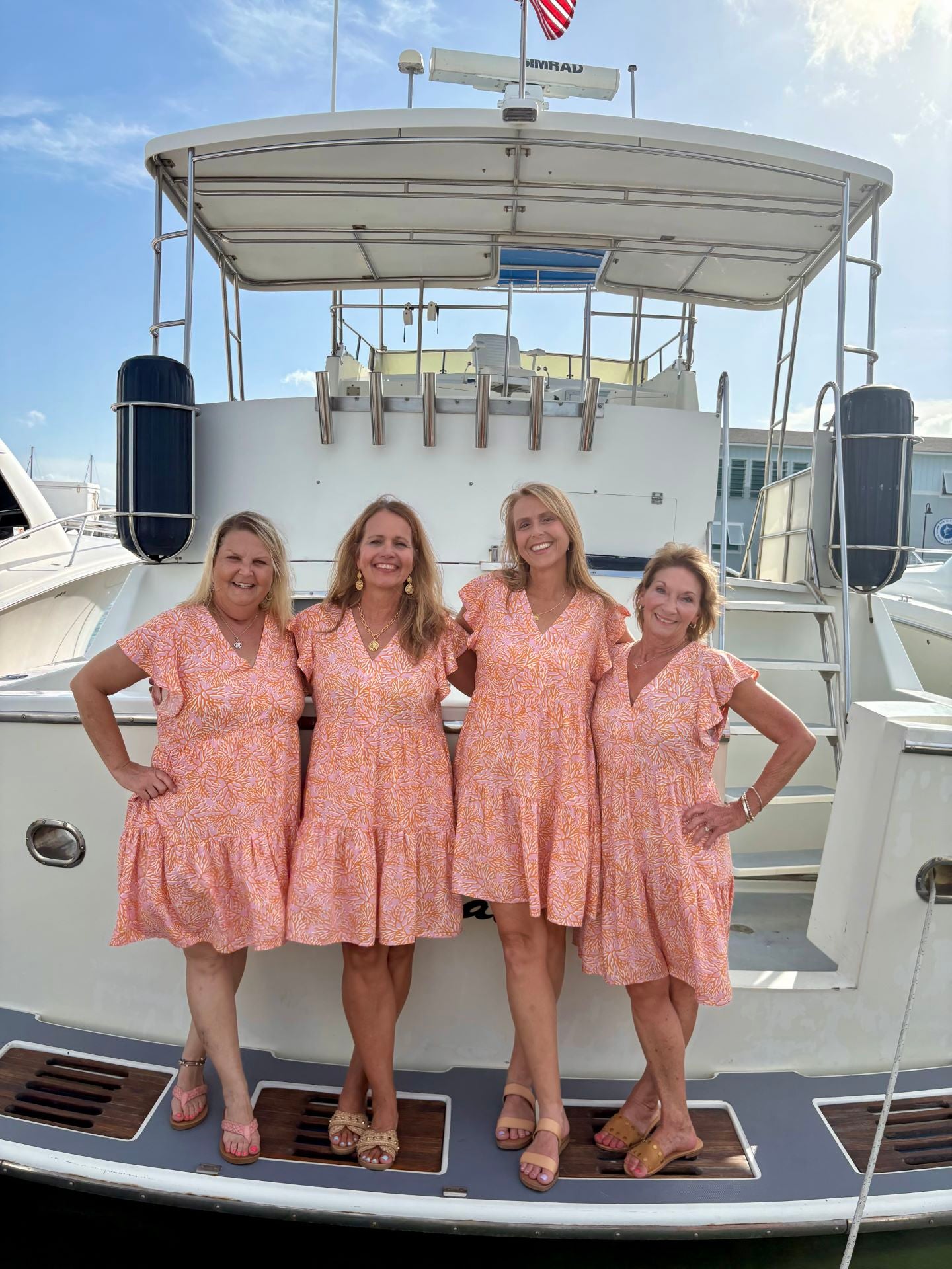 Group of women in stylish beach dresses at Port Aransas, showcasing coastal boutique clothing and summer vibes.