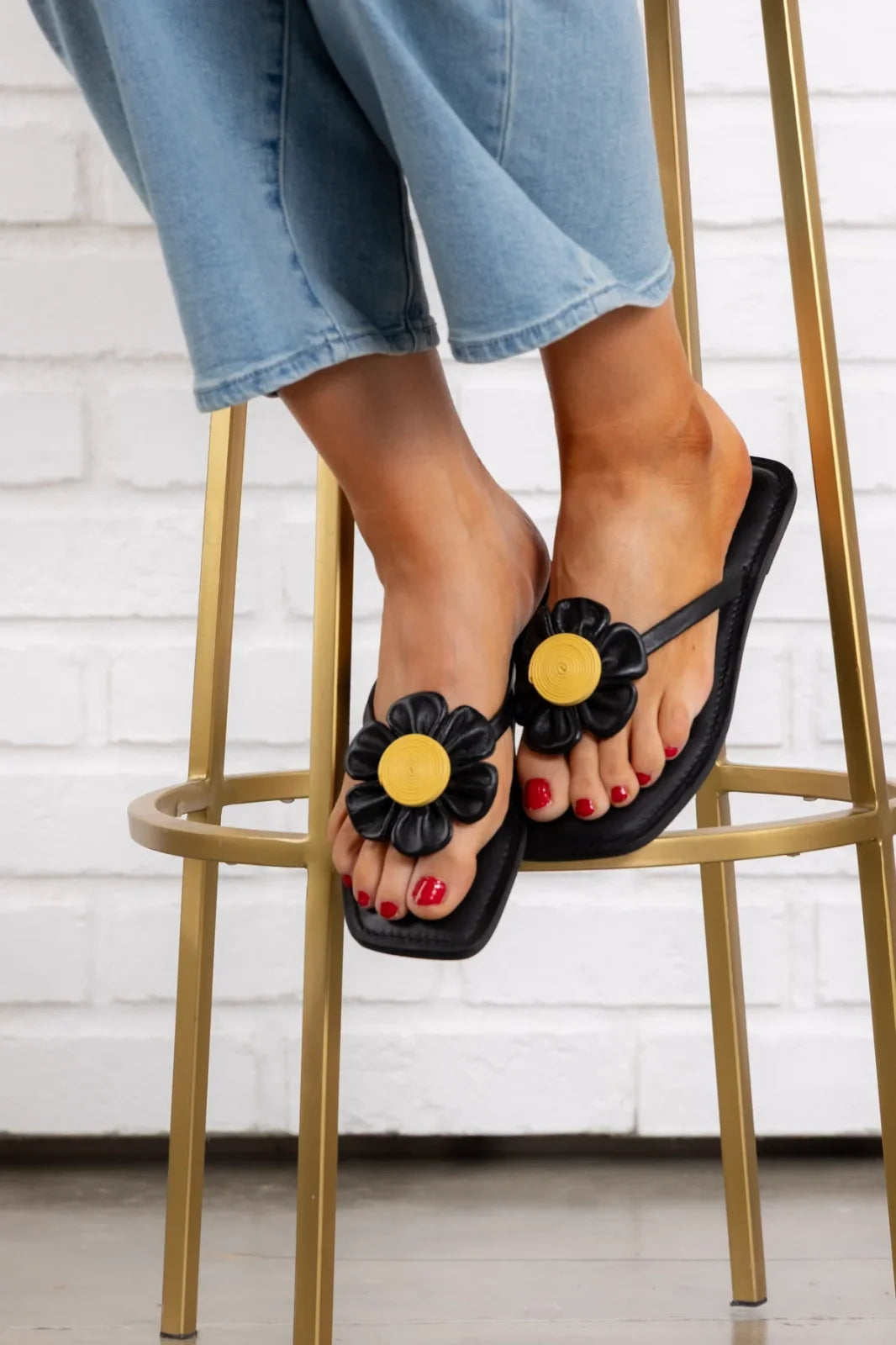 Stylish Bouquet Sandal in Black featuring flower applique, perfect for coastal boutique clothing and summer vacations.