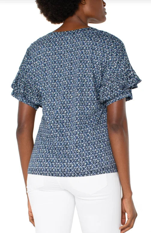 Elegant Liverpool navy/cream batik top with ruffle sleeves. Perfect for coastal boutique clothing and tropical vacations.