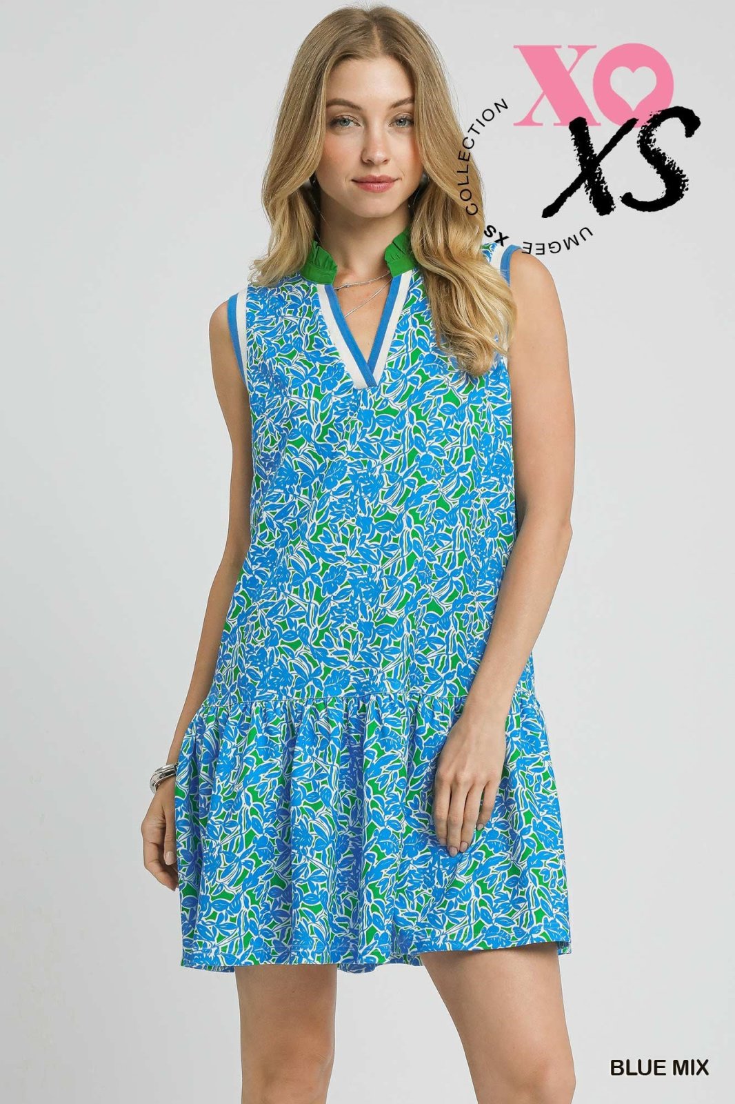 Blue and green sleeveless leaf print dress with mock collar, perfect coastal boutique clothing for a tropical vacation.