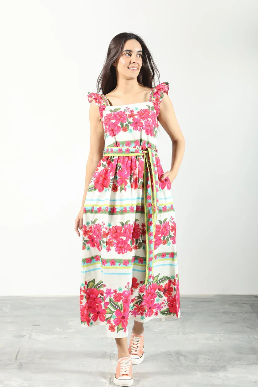 Floral belted midi sundress from coastal boutique clothing, perfect for tropical vacations and summer gatherings.