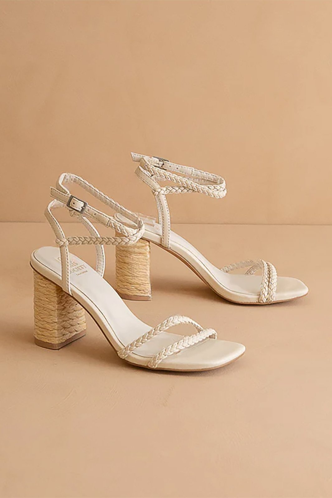 Ellis Heel: Stylish braided vegan leather sandals with a raffia-wrapped block heel, perfect for coastal boutique clothing.