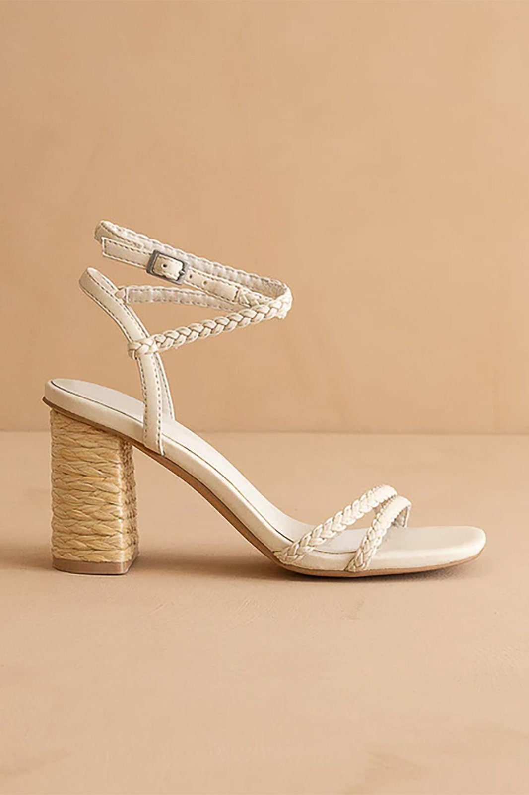 Ellis Heel featuring braided vegan leather, a square toe, and a 3-inch raffia-wrapped block heel from a coastal boutique.