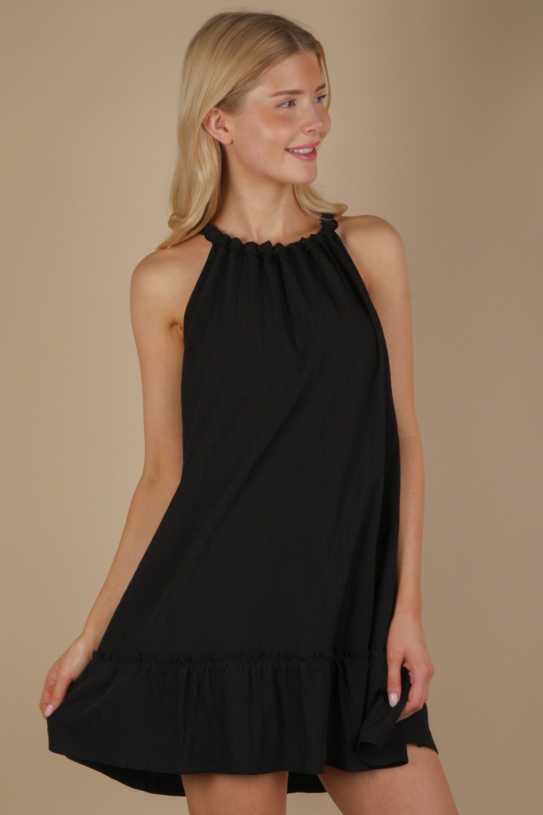 Black Halter Neck Ruffle Mini Dress from coastal boutique clothing, perfect for beach outings and Port Aransas events.