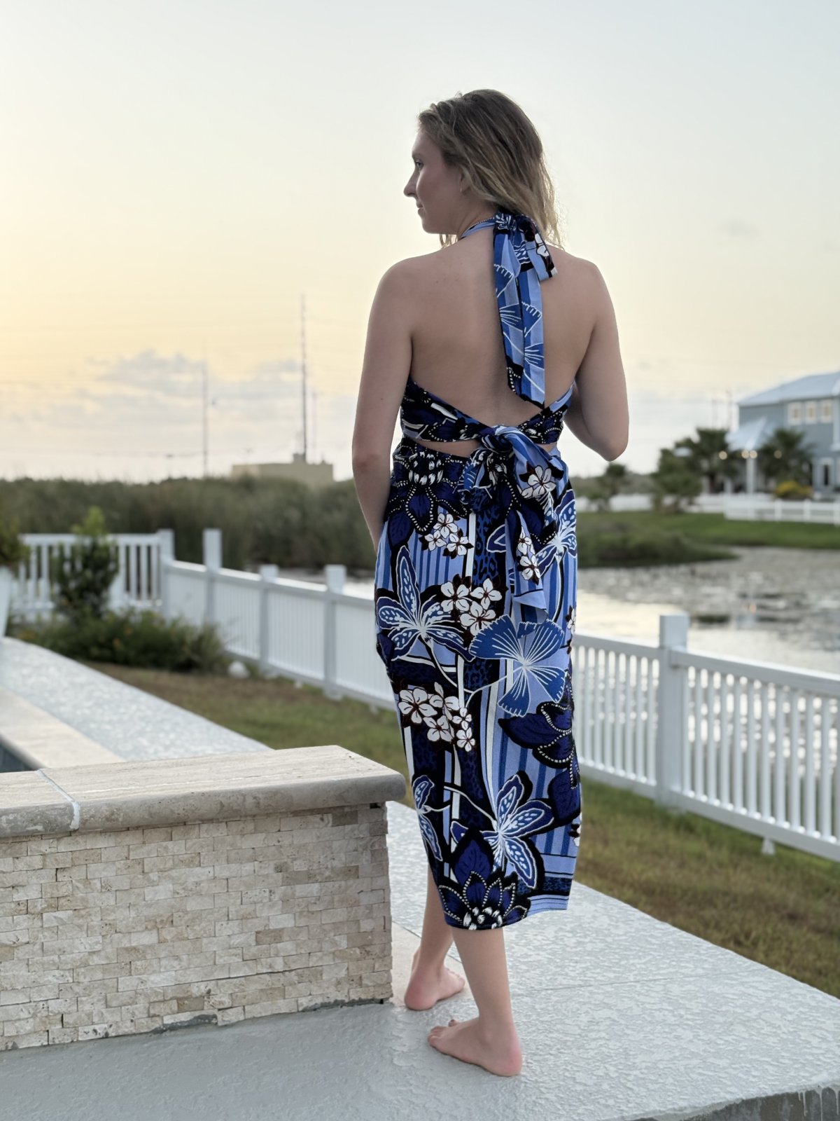 Model wearing Blakely tropical beach dress, showcasing coastal boutique clothing in Port Aransas, perfect for summer getaways.