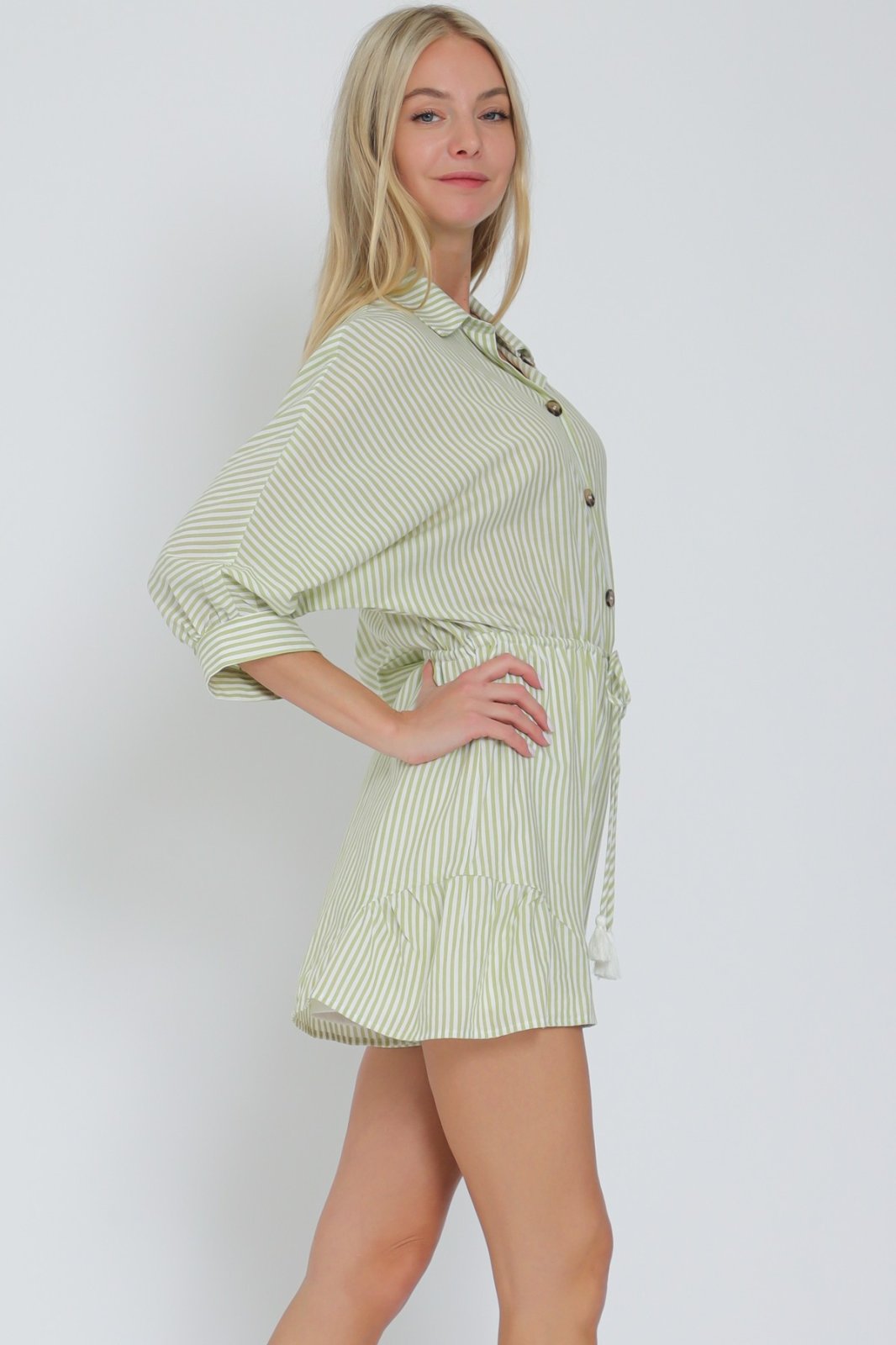 Lime green and white striped romper with 3/4 dolman sleeves from a coastal boutique, ideal for tropical vacations and curvy fashion.
