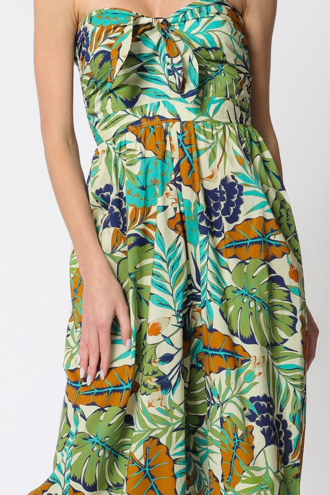 Stylish tube jumpsuit with tropical leaf print from Port Aransas boutique, perfect for coastal vacations and summer outings.