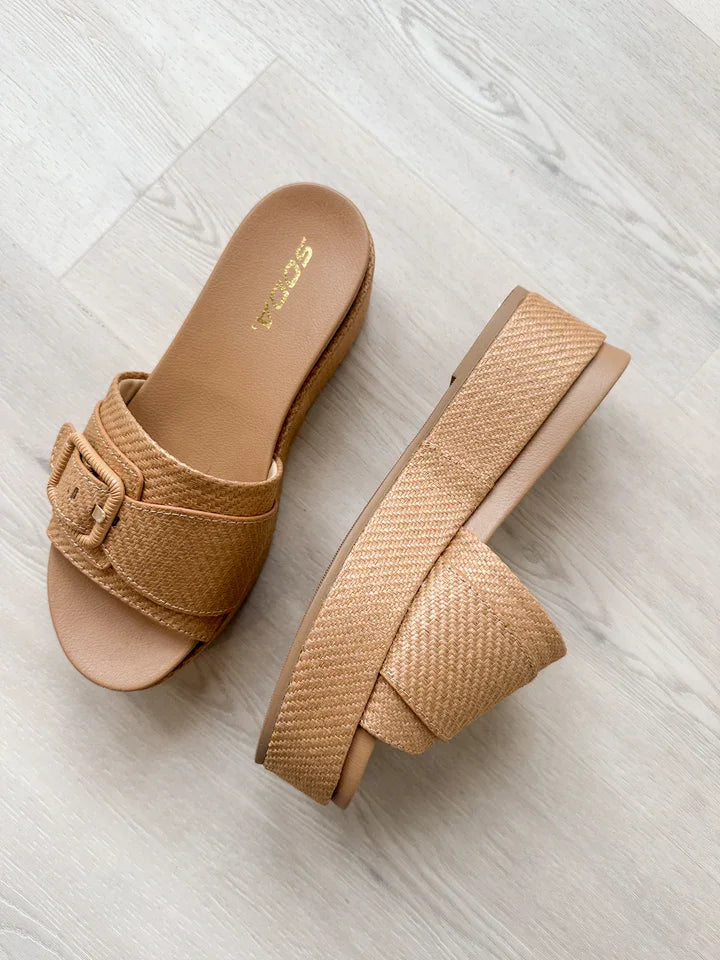 Lulah Slide in natural raffia; perfect for beach days or brunch. Shop at our Port Aransas boutique for curated women's fashion.