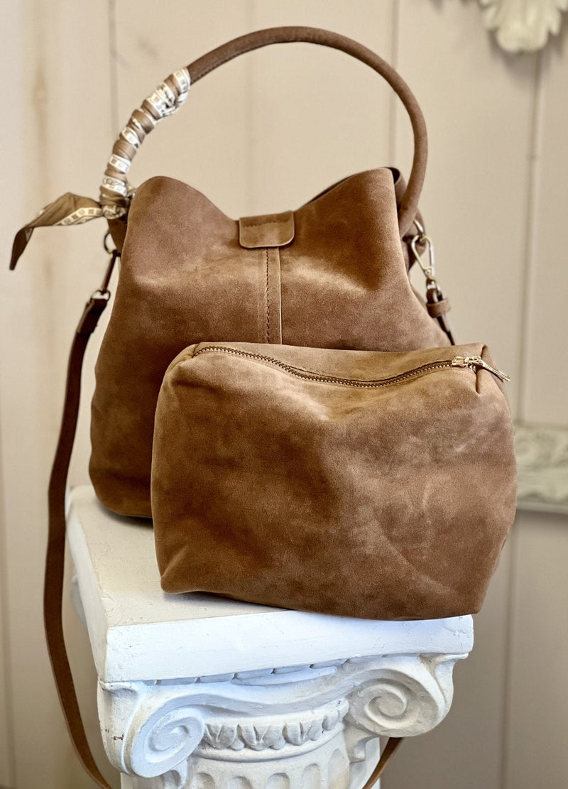 Stylish suede handbag with matching pouch, perfect for a coastal boutique clothing look. Ideal for gifts and accessories.