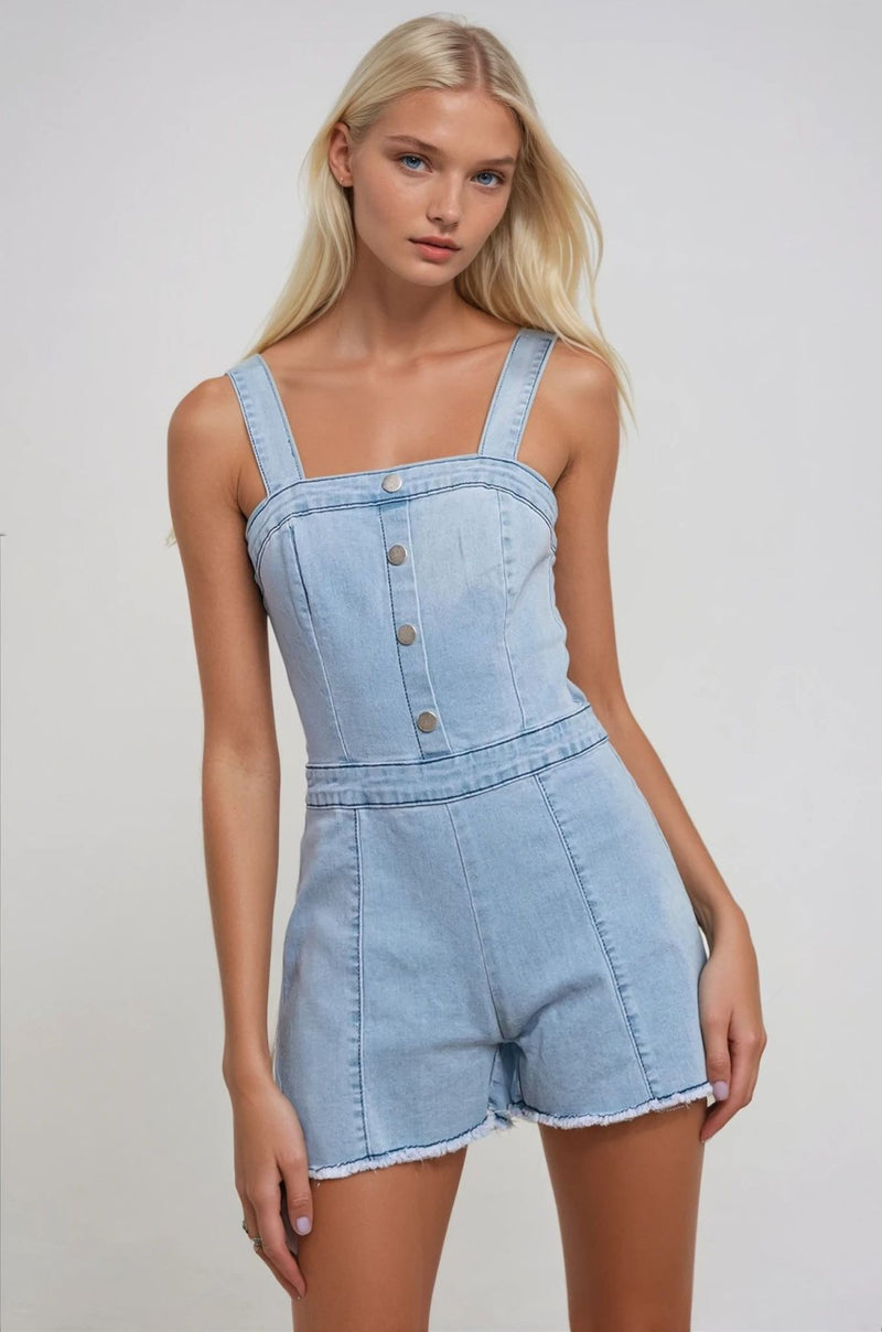 Light blue denim romper with buttons, perfect for stylish summer beach looks. Part of our Port Aransas boutique collection.