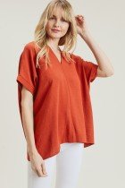 RUST TOP-JODIFL in vibrant rust color, stylish women's top for coastal boutique clothing and tropical vacation dresses.
