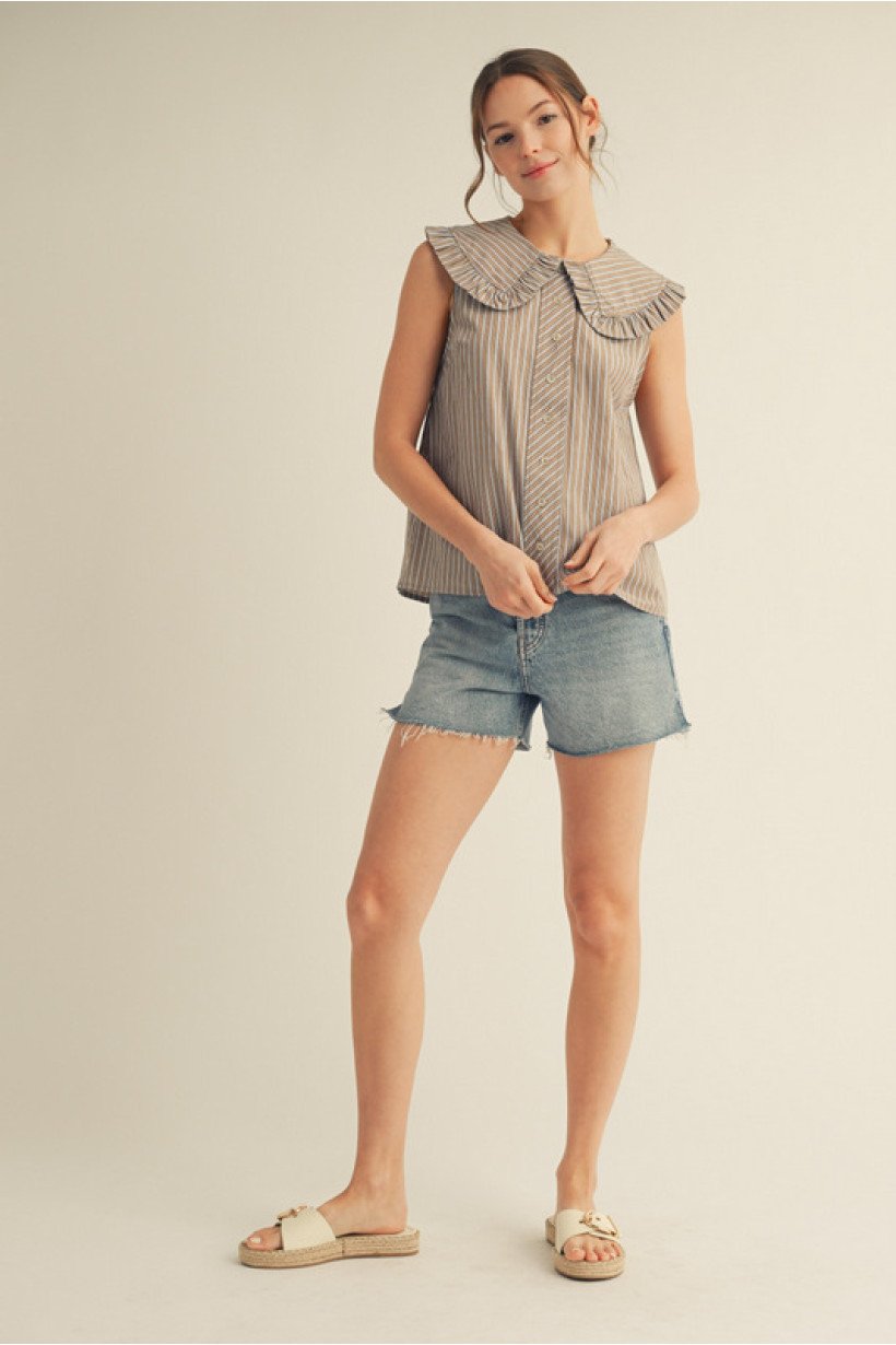 Stylish sleeveless striped top with ruffled collar, perfect for coastal boutique clothing and summer outfits.