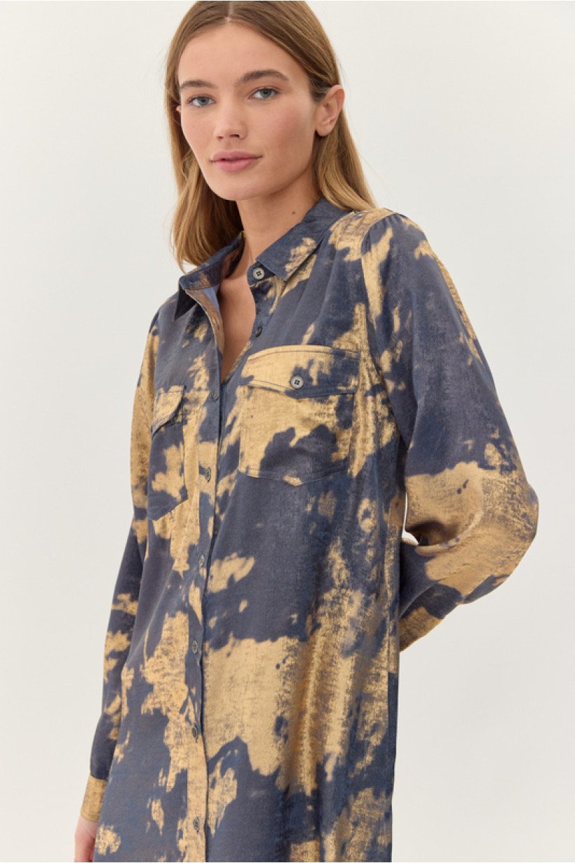 Denim and gold dress from a coastal boutique, perfect for tropical vacations. Stylish women's fashion for curvy sizes.