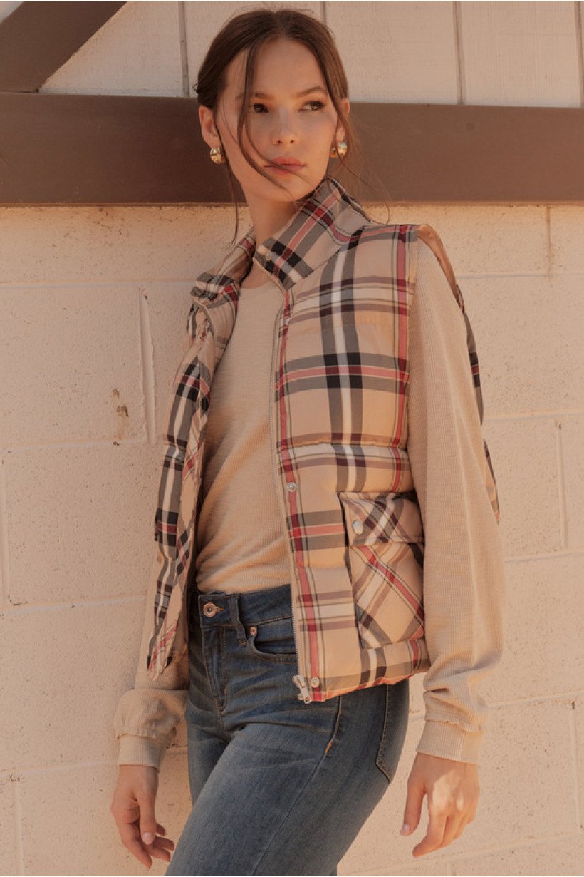 Stylish plaid puffer vest from a Port Aransas boutique, perfect for coastal fashion and trendy women's outfits.
