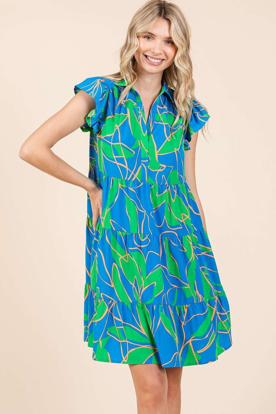 Lola Dress in blue and green print, perfect for coastal boutique clothing and tropical vacations, ideal for summer wear.