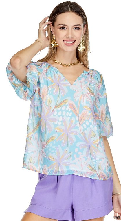 Pearla Top featuring a pastel floral print, perfect for spring and summer outfits from a coastal boutique clothing.