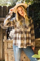 Woman wearing PLAID BABYDOLL FLANNEL TOP from Raggdoll Boutique, showcasing trendy coastal style in Port Aransas.