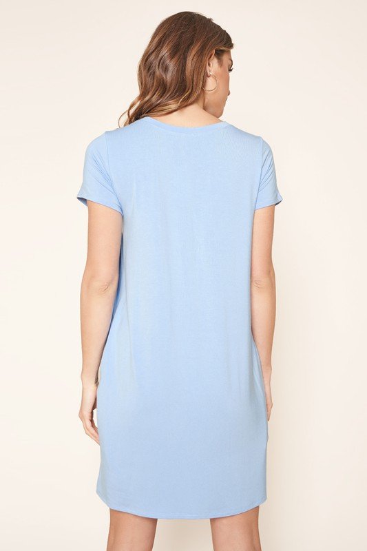 WEEKENDER LIGHT BLUE KNIT DRESS back view showcasing short sleeves and relaxed fit from Raggdoll Boutique.