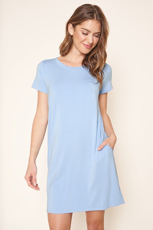WEEKENDER LIGHT BLUE KNIT DRESS from Raggdoll Boutique featuring short sleeves and pockets, ideal for summer outfits.