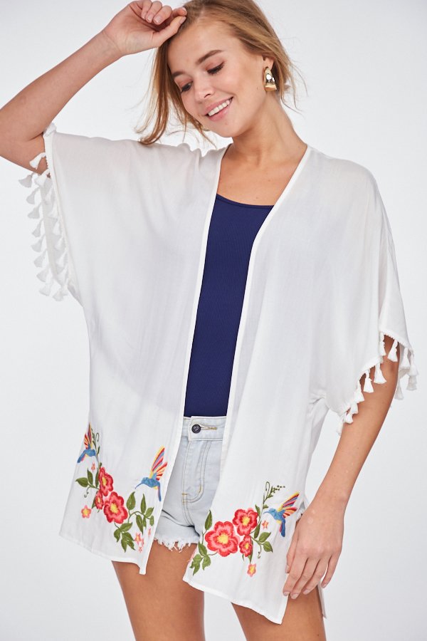 Stylish woman wearing a WHITE EMBROIDERED KIMONO from Raggdoll Boutique, perfect for summer outfits Texas.