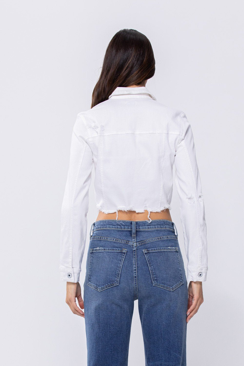 Back view of WHITE CROP SLIGHT DISTRESS JACKET from Raggdoll Boutique, perfect for summer outfits Texas and trendy coastal style.