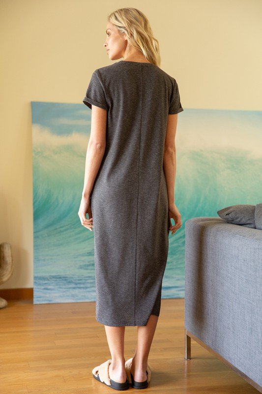 Woman wearing FAVORITE EVERYDAY STRIPED KNIT DRESS, a black and taupe midi knit dress from Raggdoll Boutique.