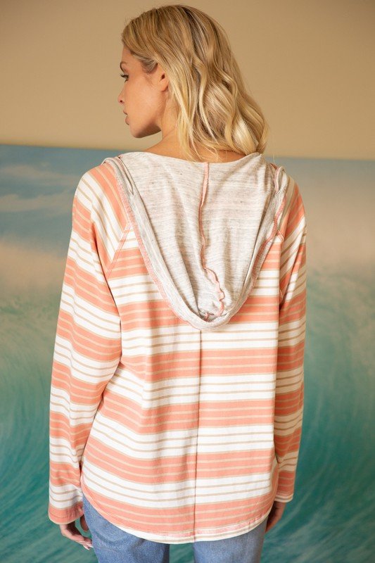 Back view of ASPEN STRIPED V-NECK HOODIE showcasing its striped design and cozy hood.