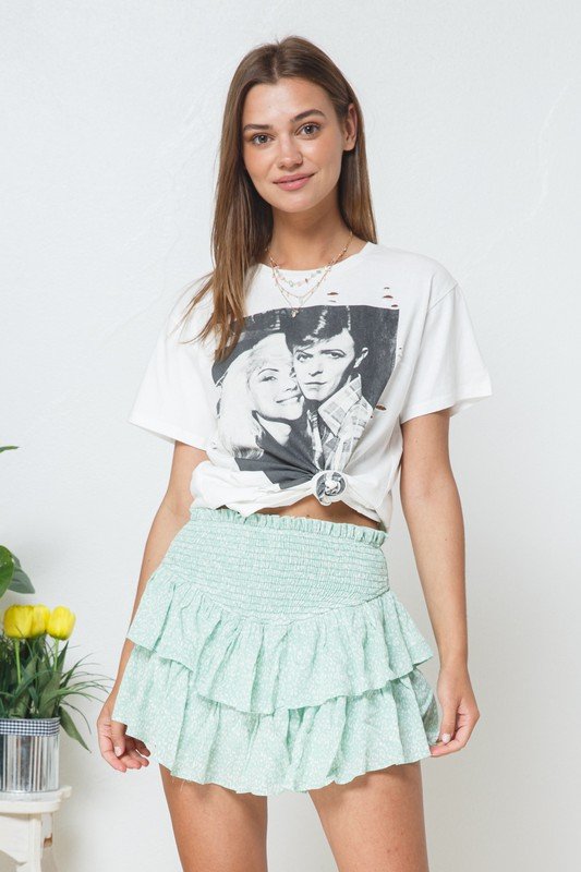 CUTE! MINT AND WHITE ANIMAL PRINT SKORT styled with a trendy graphic tee, perfect for summer outfits at Raggdoll Boutique.