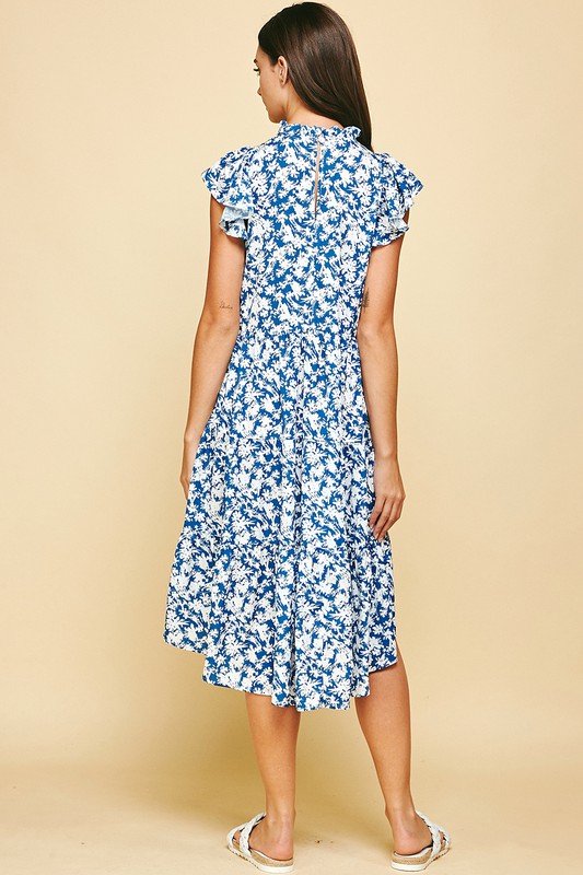 Model wearing the BLOOMED TO PERFECTION DRESS from Raggdoll Boutique, showcasing trendy coastal style.