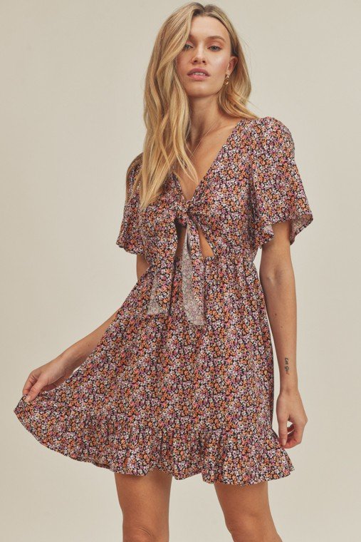 FLOWER BOMB! TIE-FRONT DRESS in floral print featuring short sleeves and ruffle hem from Raggdoll Boutique.